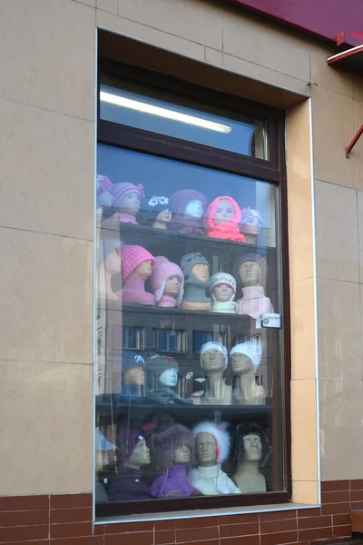 Show-window of shop of headdresses — Stock Photo, Image