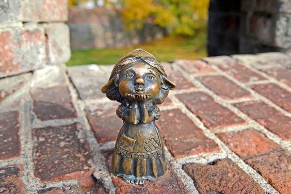 KALININGRAD, RUSSIA - OCTOBER 24, 2021: Figurine of Homlin Mom stands in the loophole of Wrangel Tower