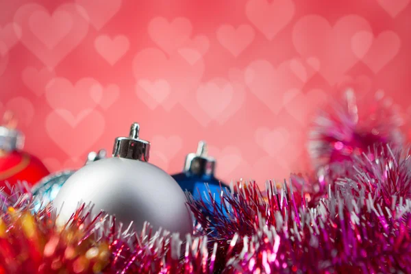 Christmas balls isolated on red background — Stock Photo, Image