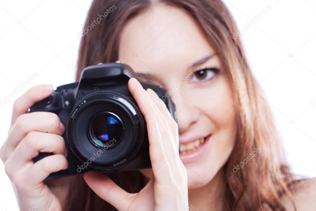 Smiling woman with professional camera