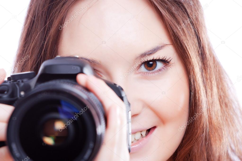 Smiling woman with professional camera