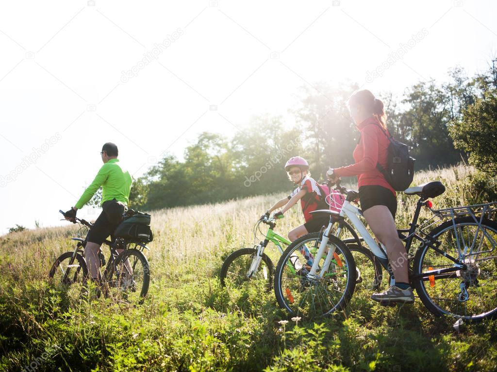 family cycling outdoors