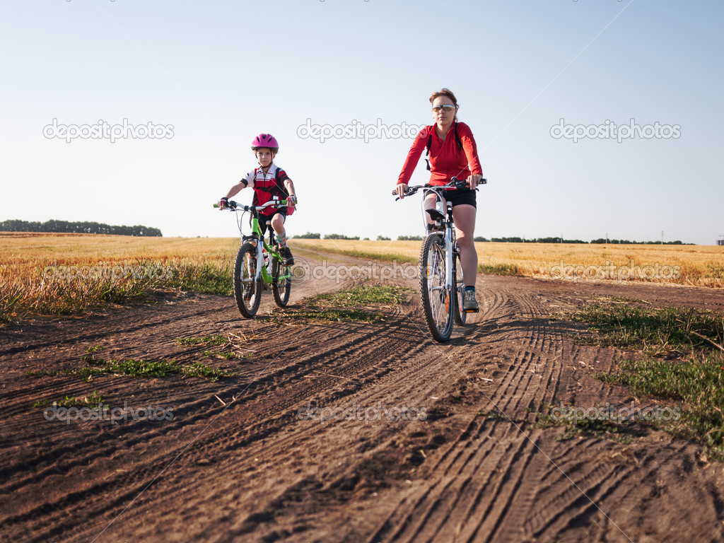 family cycling in summer