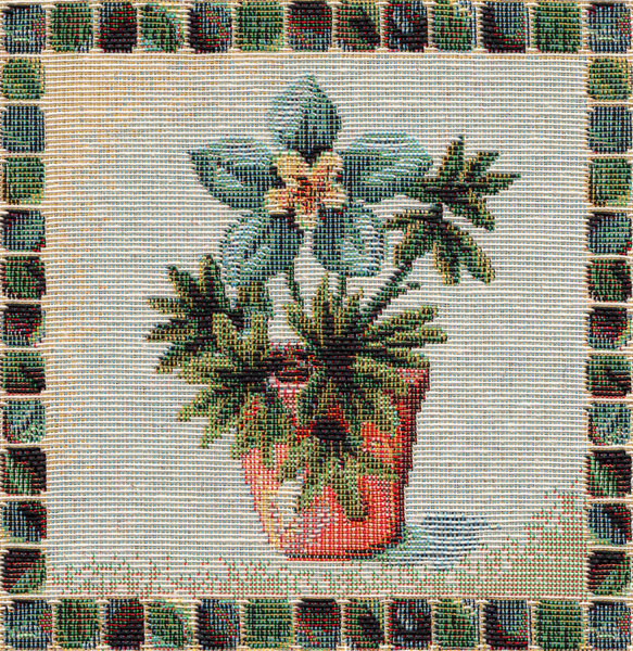 Closeup of retro tapestry fabric pattern with classical image of the colorful floral ornament