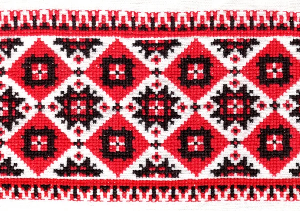 Red ornament stitched on linen background — Stock Photo, Image