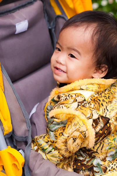 Asian female baby smile in perambulator — Stock Photo, Image