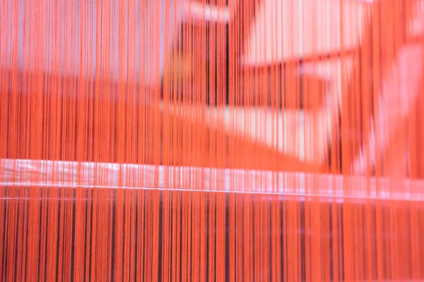 Red silk in machine — Stock Photo, Image