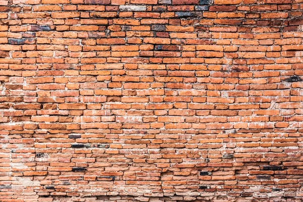 Starý oranžové popraskané cihlová zeď — Stock fotografie