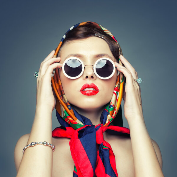 The square image of a girl in a headscarf