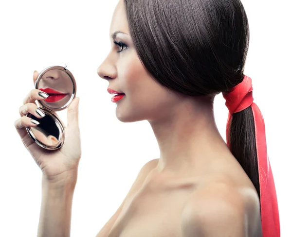 Isolated portrait of a girl with a mirror — Stock Photo, Image