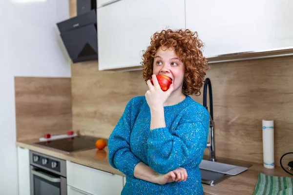 Young Beautiful Woman Curly Red Hair Eating Juicy Red Apple —  Fotos de Stock