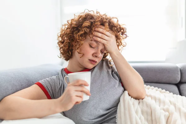 Young Woman Caught Cold Or Flu Illness. Portrait Of Unhealthy Girl scared or virus infection. Cold And Flu. Portrait Of Ill Woman Caught Cold