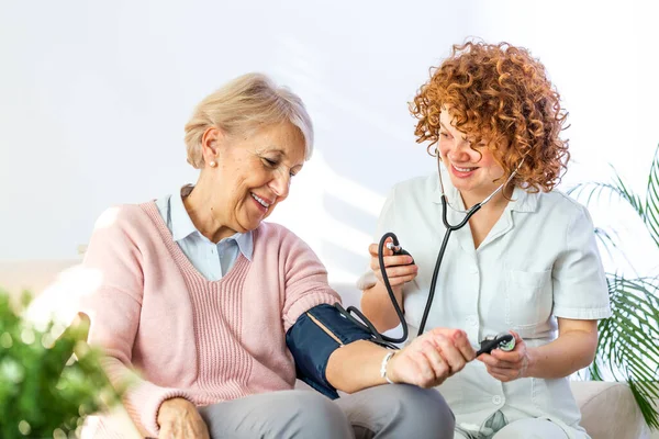 Happy Senior Woman Having Her Blood Pressure Measured Nursing Home — Foto Stock