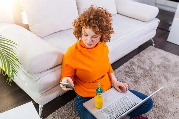 Cute Female Red Hair Freelancer Reading Text Messages While Sitting — Stock fotografie