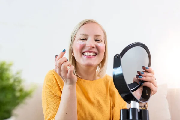 Smiling Young Woman Looking Hand Mirror Applying Face Cream Young — Foto de Stock