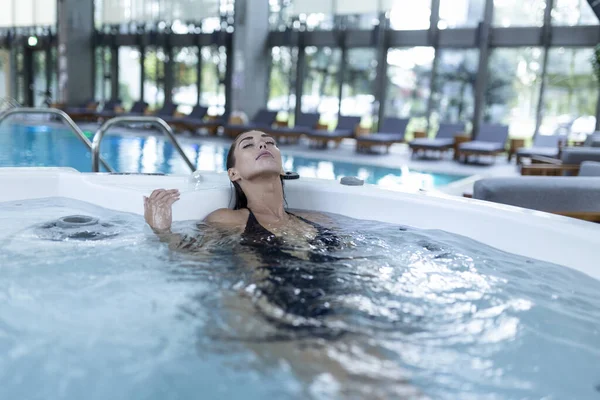 Excited Female Enjoys While Splashing Warm Water Spa Procedure Whirlpool — 스톡 사진