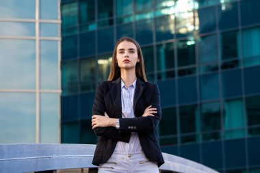Portrait of a successful business woman. Beautiful young female executive in an urban setting