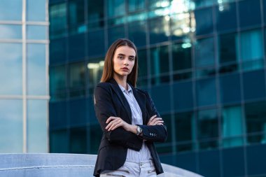 Portrait of a successful business woman. Beautiful young female executive in an urban setting