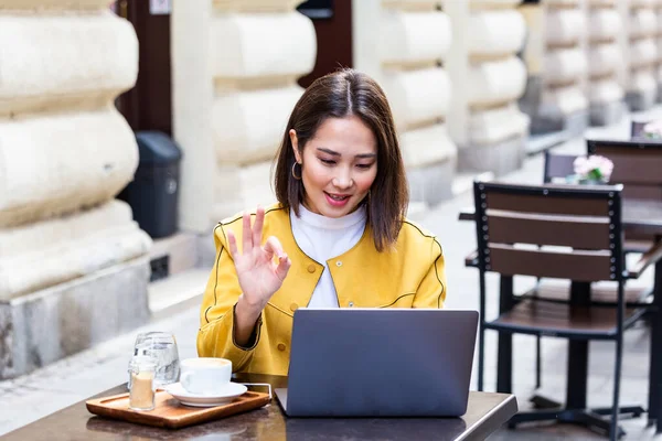 Beautiful Young Asian Female Student Using Portable Laptop Computer While — Stok fotoğraf