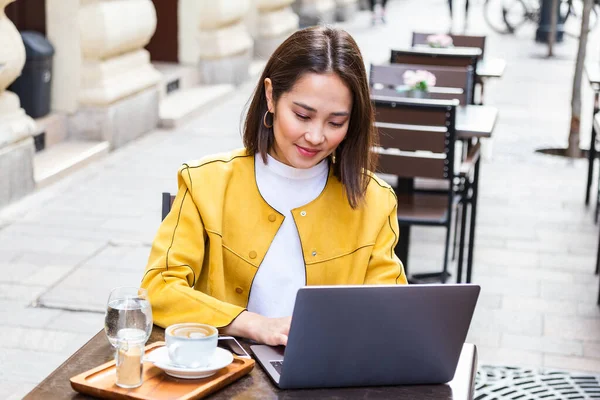 Beautiful Young Asian Female Student Using Portable Laptop Computer While — Stok fotoğraf