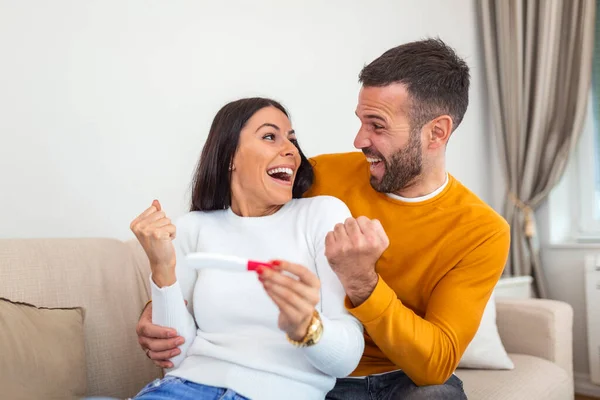 Shot Happy Young Couple Taking Pregnancy Test Home Happy Excited — Stockfoto