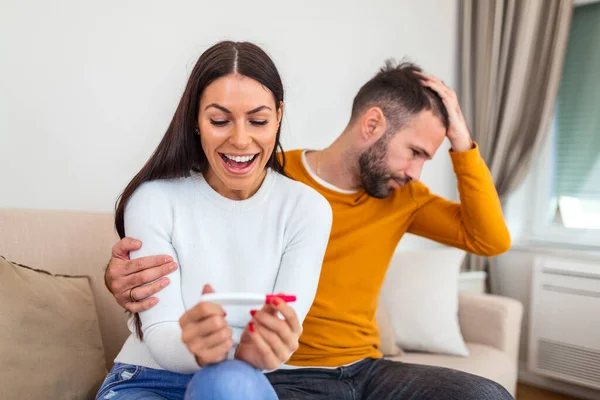 Ready Worried Man Checking Pregnancy Test His Excited Wife Sitting — Stockfoto