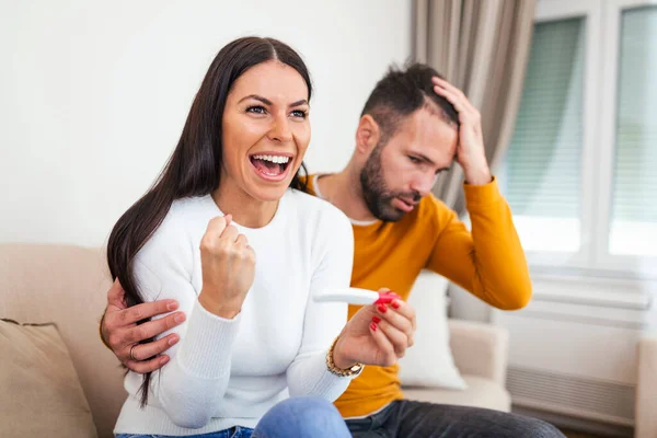 Ready Worried Man Checking Pregnancy Test His Excited Wife Sitting — Stockfoto