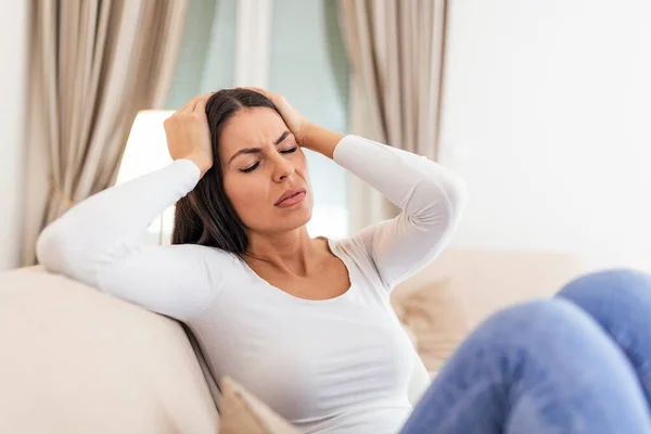 Portrait Attractive Woman Sitting Sofa Home Headache Feeling Pain Expression — Foto de Stock