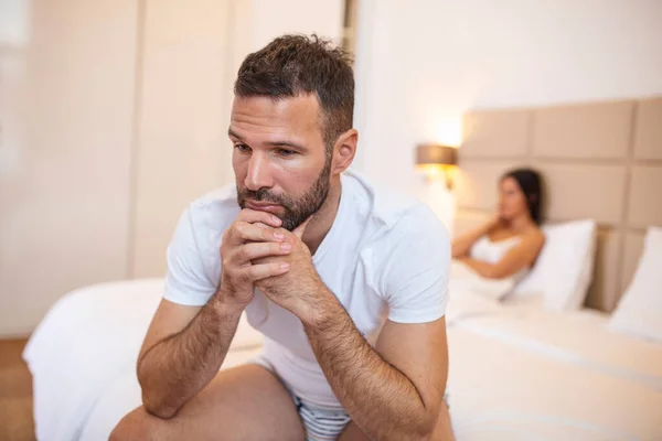 Young Couple Having Problem Guy Sitting Bed Looking Sadly Away — Φωτογραφία Αρχείου