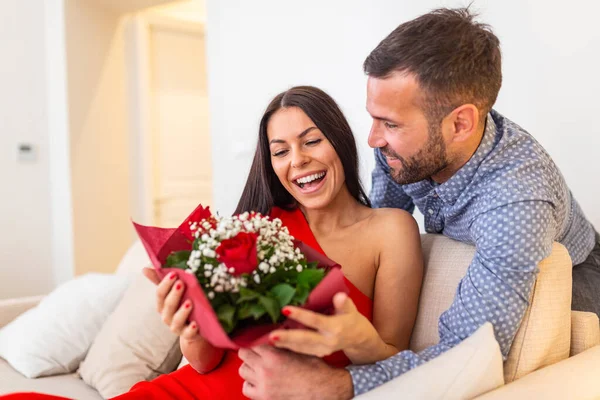 Excited Young Woman Receiving Unexpected Bouquet Red Roses Husband Home — 图库照片