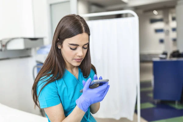 Exhausted Female Nurse Sits Bed Hospital Shift Break She Daydreams — Φωτογραφία Αρχείου