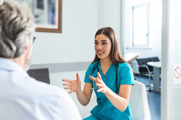 Patient Doctor Hospital Waiting Room Discussing His Symptoms Young Female — Stockfoto