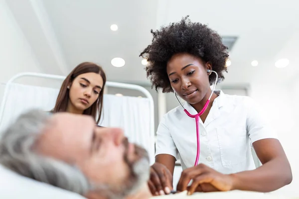 Sick Man Patient African American Female Doctor Listens His Chest — ストック写真