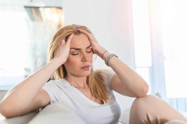 Portrait Young Blond Woman Sitting Couch Home Headache Migraine Beautiful — Foto de Stock