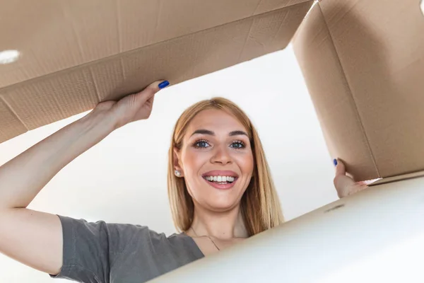 Delivery Concept Excited Woman Unpacking Opening Carton Box Trying Get — стоковое фото