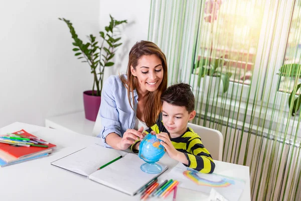 Learning from home, Home school kid concept.Little boy study with online learning with mother help. Quarantine and Social distancing concept. Learning at home, online learning.