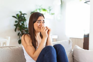 Close up young woman feeling upset, sad, unhappy or disappoint crying lonely at home. Emotional shock and life problems