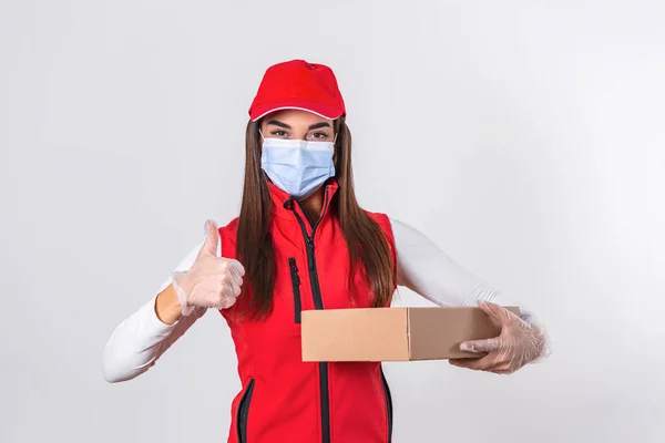 Delivery Woman Wearing Medical Mask Gloves Holding Box Showing Thumb — Fotografia de Stock