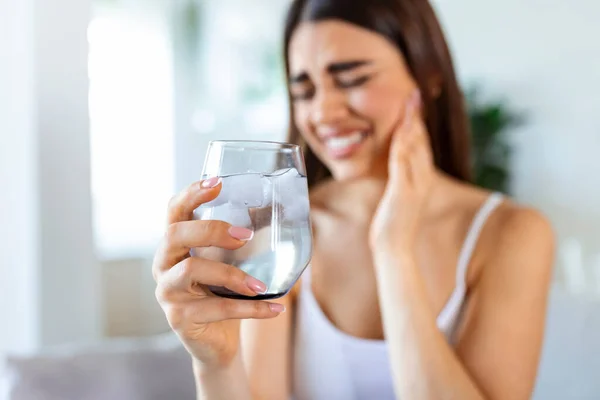 Young Woman Sensitive Teeth Hand Holding Glass Cold Water Ice — Foto de Stock