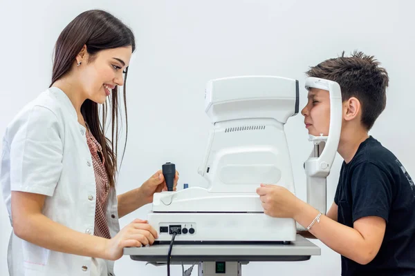 Attractive Female Doctor Ophthalmologist Checking Eye Vision Handsome Young Boy — ストック写真