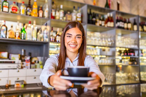 Beautiful Female Barista Holding Cup Hot Coffee Looking Camera Smiling — Stok fotoğraf