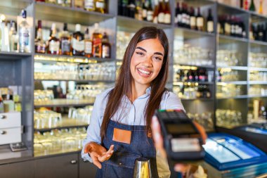 Contactless payment concept, female holding terminal nfc technology on counter, client make transaction pay bill on terminal rfid cashier machine in restaurant store, close up view