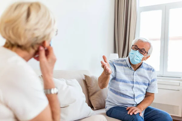 Senior Friends Having Conversation Sofa Home Covid Pandemic Elderly Wearing — Foto Stock