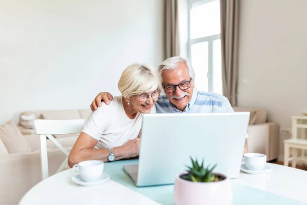 Happy senior couple with laptop having video call. Retirement senior couple lifestyle old age, communicate connecting technology people, quarantine concept.