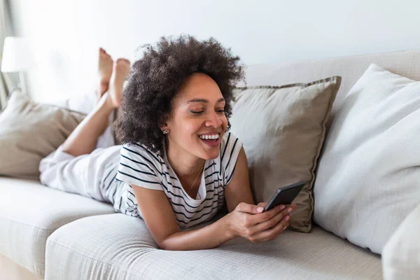 Pretty Girl Using Her Smartphone Couch Home Living Room Young — Stock fotografie