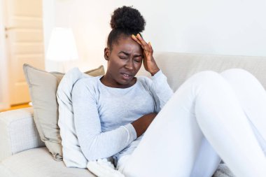Health And Pain. Stressed Exhausted Young black Woman Having Strong Tension Headache. Closeup Portrait Of Beautiful Sick Girl Suffering From Head Migraine, Feeling Pressure And Stress.