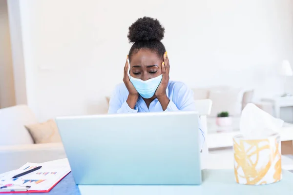 Safety during COVID-19 pandemic. African American Businesswoman wearing mask in the office during COVID-19 pandemic. Businesswoman in medical face protection mask. Business woman with mask