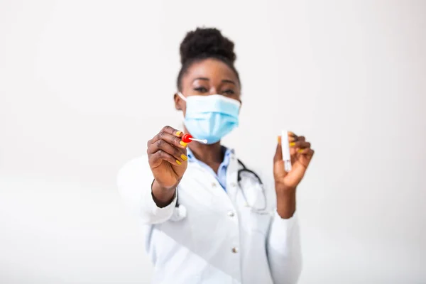Female african american doctor holding a swab collection stick, nasal and oral specimen swabbing , patient PCR testing procedure appointment, Coronavirus COVID-19 global pandemic crisis