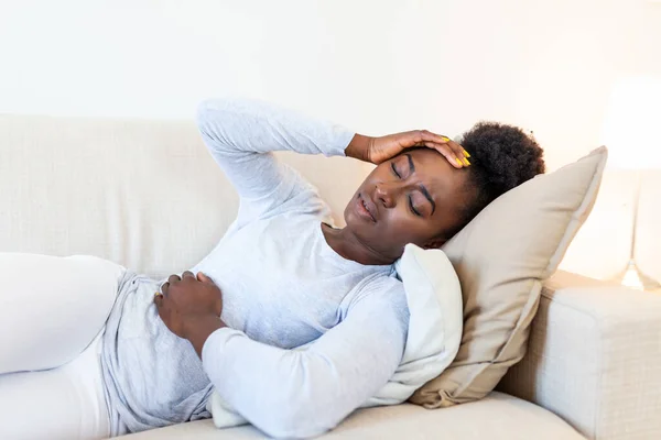 Portrait Young Black Girl Sitting Couch Home Headache Stomach Pain — Stock fotografie