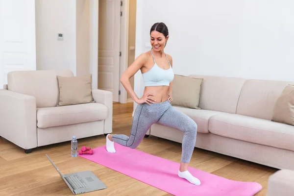 Gorgeous Young Woman Exercise Mat Home Watching Workout Tutorial Online — 스톡 사진